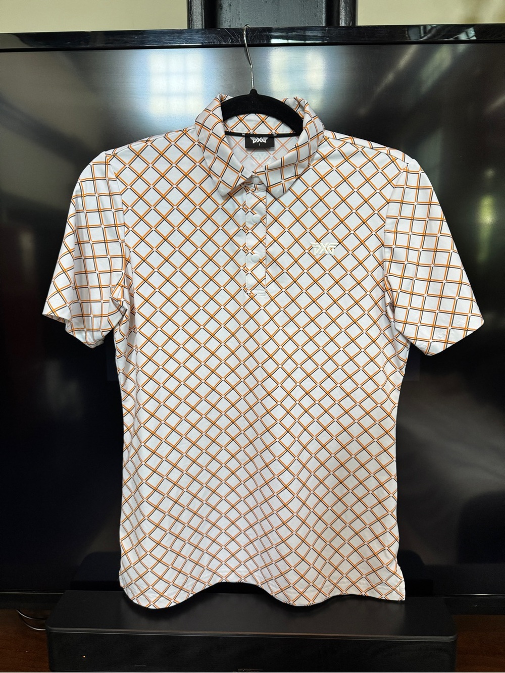 PXG White Polo with Orange Grid Pattern